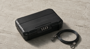The Detox Kit: the Box and Pouch on a concrete surface in directional light