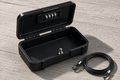 The Detox Kit: the combination lock Box open beside the signal-blocking Pouch