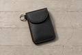 The Pouch, carbon-weave Faraday sleeve, sold as a pair