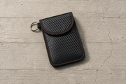The Pouch, carbon-weave Faraday sleeve, sold as a pair