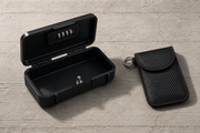 The Box: a hard-shell combination lock case, open, with its coiled steel cable